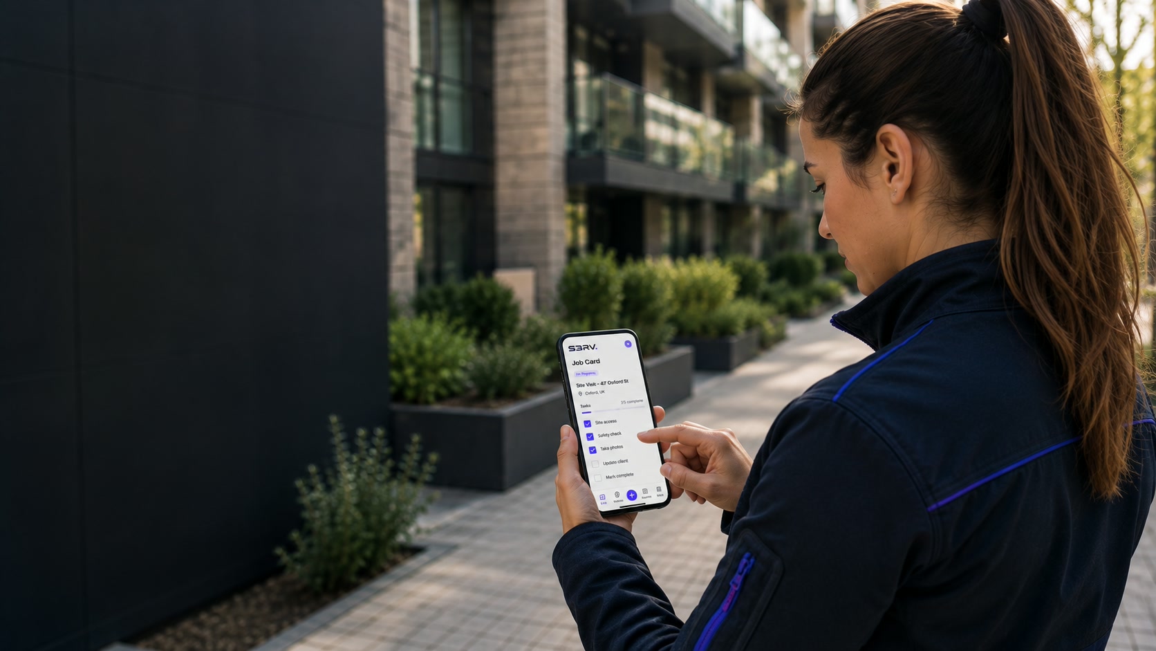 Field operative using the S3RV job card app on site